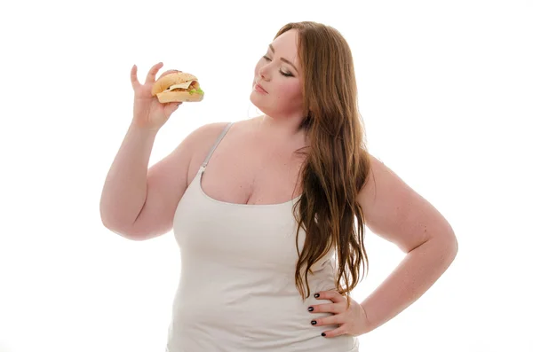 şişman kadın beyaz arka plan üzerinde izole hamburger yemek
