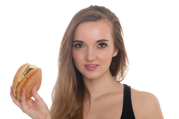 Krásná mladá dívka s Burger v ruce izolovaných na bílém pozadí — Stock fotografie