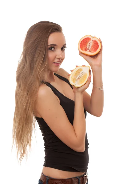 Eine junge schöne Frau mit Zitrone und Grapefruit in den Händen isoliert auf weißem Hintergrund — Stockfoto