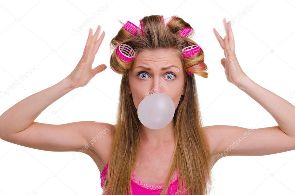 beautiful girl in hair curlers with gum