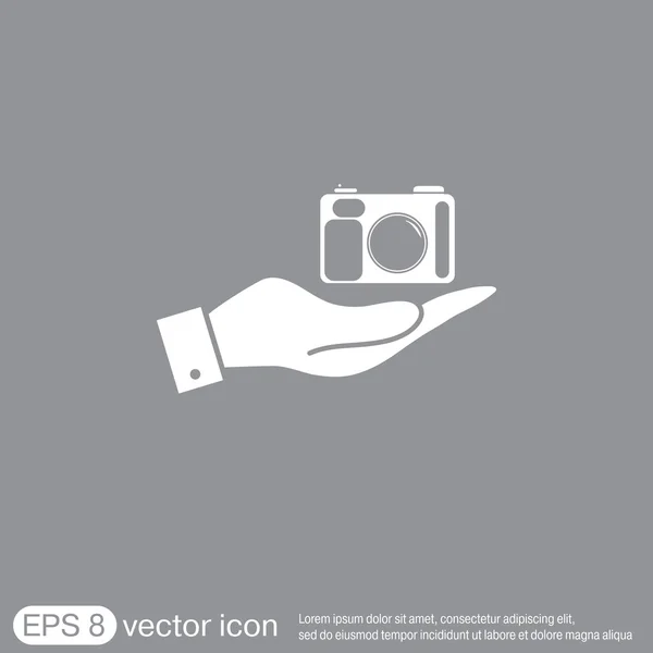 Mão segurando ícone de câmera de foto —  Vetores de Stock