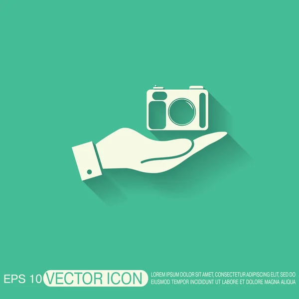 Hand met fotocamera — Stockvector