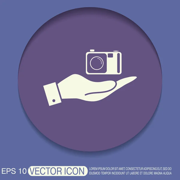 Hand met fotocamera — Stockvector