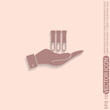 bir ampul ya da kabı tutan el. 