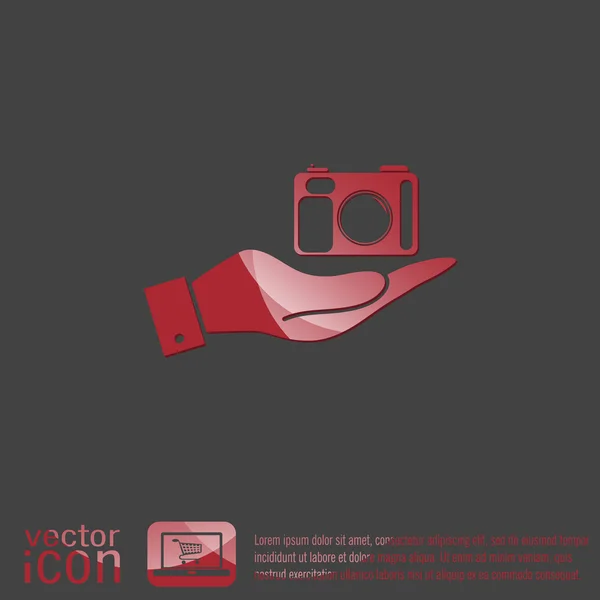 Hand holding a photo camera — Stock Vector