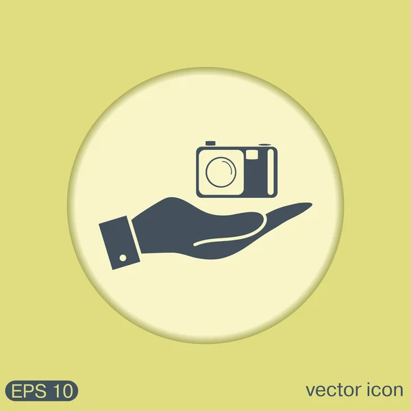 Hand holding photo camera — Stock Vector