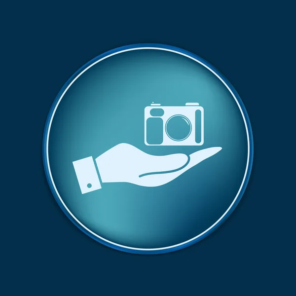 Hand holding a photo camera — Stock Vector