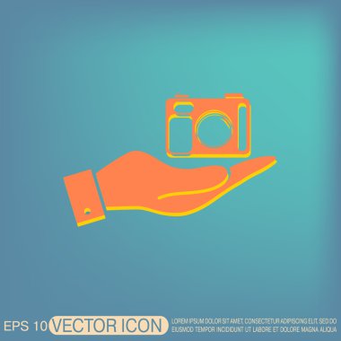 Fotoğraf makinesi tutan el