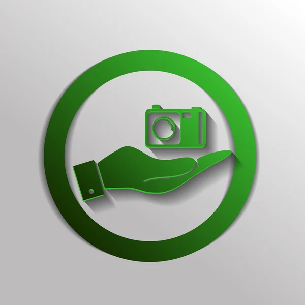 Hand met een fotocamera — Stockvector