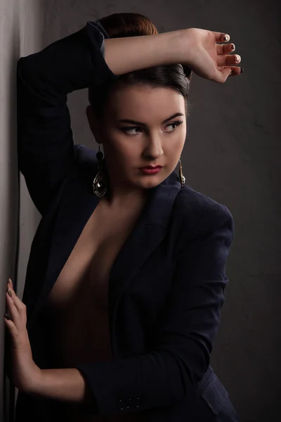 Beautiful girl with sexy breasts in jacket and beauty hair — Stock Photo, Image