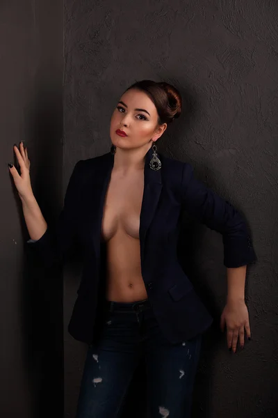 Beautiful girl with sexy breasts in jacket and beauty hair — Stock Photo, Image