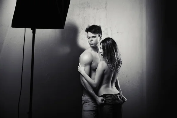 Sexynaked couple of muscular boy in underwear and girl undressing — Stock Photo, Image