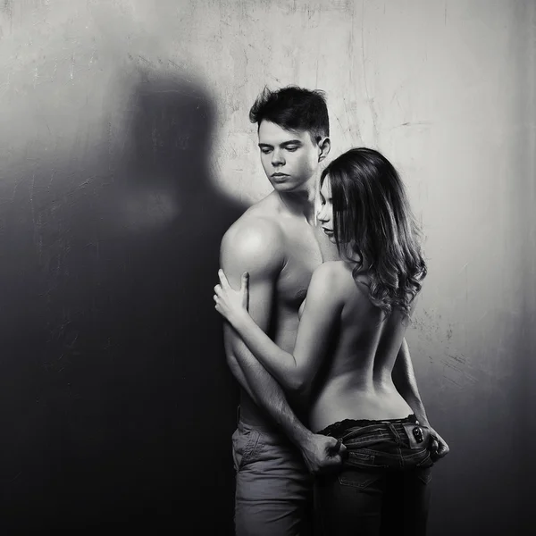 Sexynaked couple of muscular boy in underwear and girl undressing — Stock Photo, Image