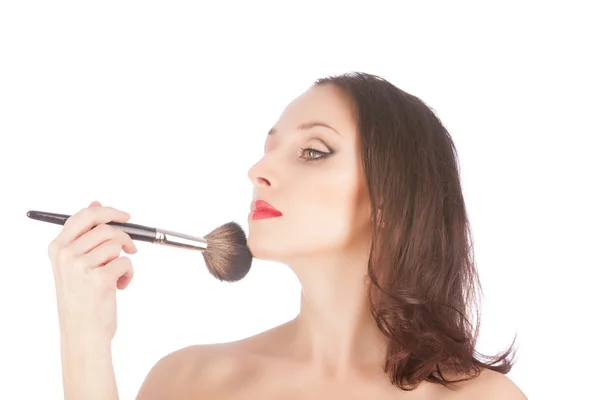 Mooie blonde vrouw vóór en na make-up met een make-up borstel over Wit — Stockfoto