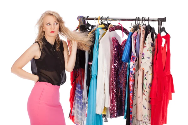 Which dress should I pick, young woman holding wear — Stock Photo, Image