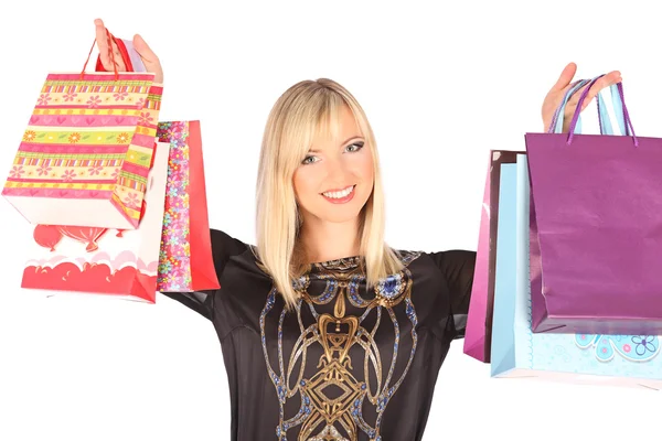 Jovem mulher bonita de pé com sacos de compras coloridos — Fotografia de Stock