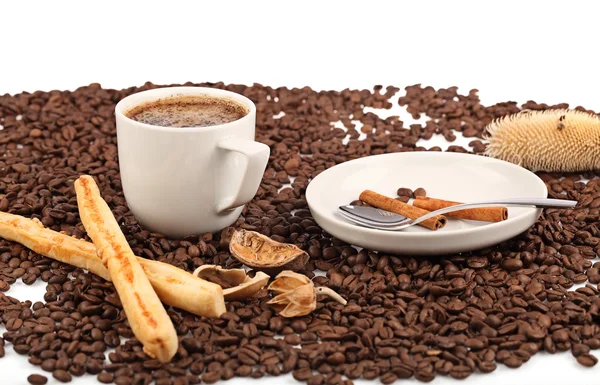 Coffee cup with bread and beans on a white background. — Stock Photo, Image