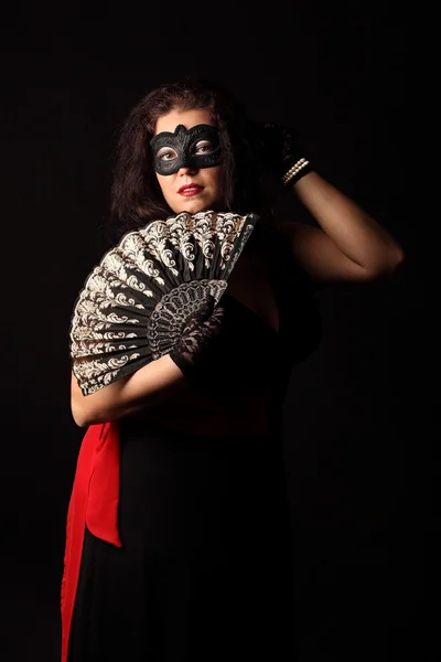 Portrait of mysterious woman with folding fan and mask — Stock Photo, Image