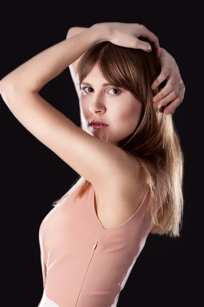 Portrait of young and beautiful girl over black background — Stock Photo, Image