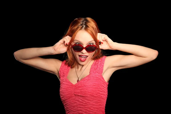 Chica con gafas en forma de corazón y ojos cerrados sonriendo —  Fotos de Stock