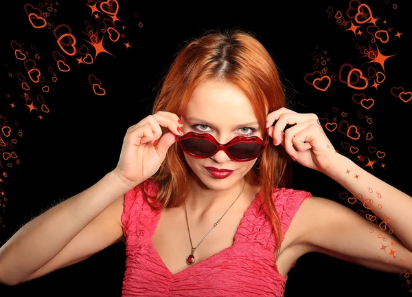 Girl with heart-shaped glasses and closed eyes smiling — Stock Photo, Image