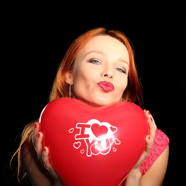 Young beautiful woman with big red heart — Stock Photo, Image