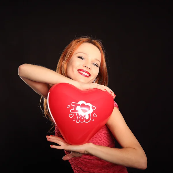 Young beautiful woman with big red heart — Stock Photo, Image
