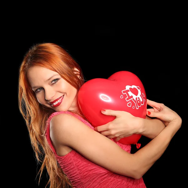 Young beautiful woman with big red heart — Stock Photo, Image