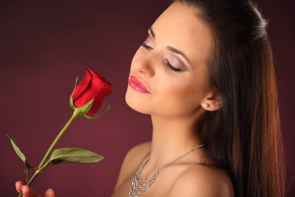 Valentines beautyfull girl with red rose in her hands