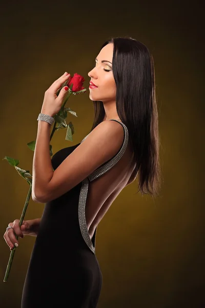 Valentines beautyfull girl with red rose in her hands — Stock Photo, Image