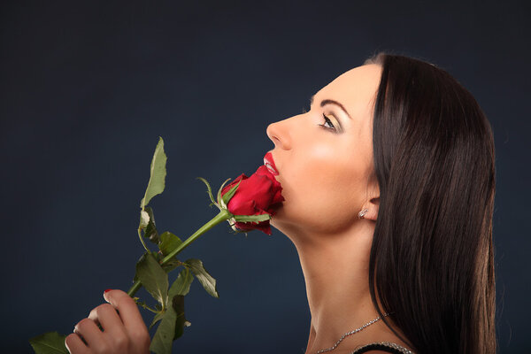 Valentines beautyfull girl with red rose in her hands