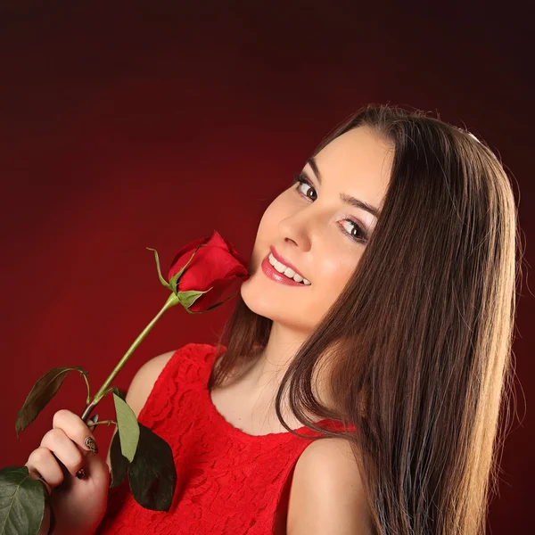 Valentines beautyfull girl with red rose in her hands — Stock Photo, Image