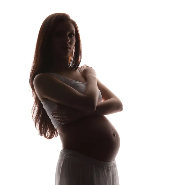 Mulher grávida acariciando sua barriga sobre fundo branco — Fotografia de Stock