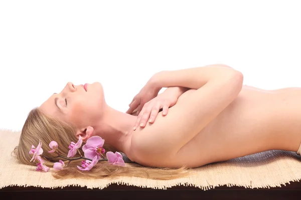 Picture of woman in spa salon lying on the massage desk — Stock Photo, Image