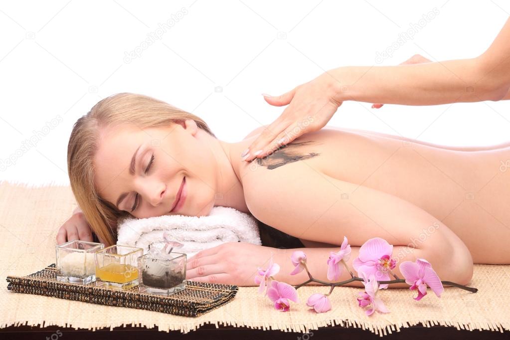 Young woman getting a massage in spa