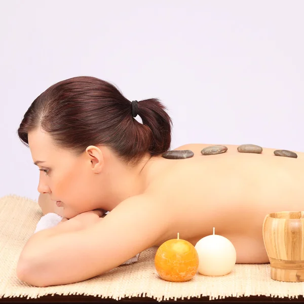 Young woman getting a massage in spa — Stock Photo, Image