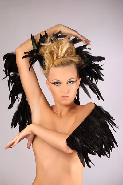 Portrait of woman shaman with raven feather in her hair — Stock Photo, Image