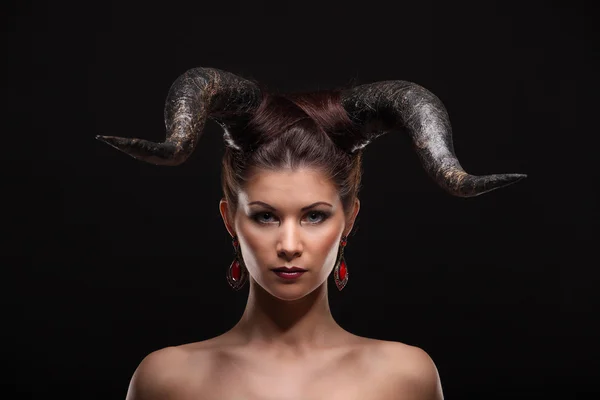The beautiful young girl with horns like devil or angel — Zdjęcie stockowe