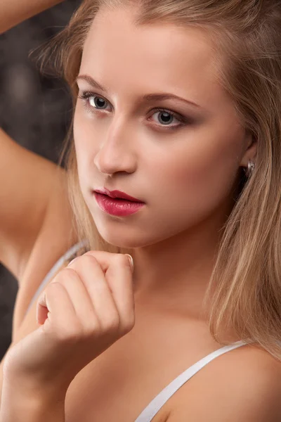 Studio portrait of smiling beauty in lingerie — Stock Photo, Image