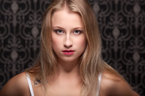 Studio portrait of smiling beauty in lingerie — Stock Photo, Image