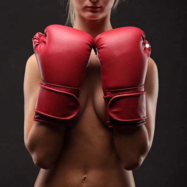 Sexy brunette posing topless in boxing gloves — Stock Photo, Image