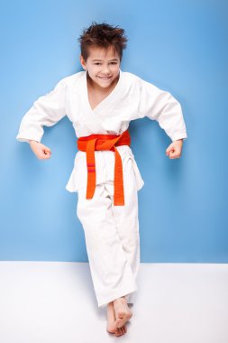 Boy in karate costume.