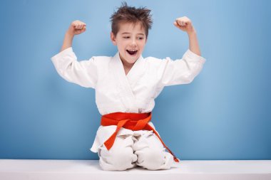 Boy in karate costume.