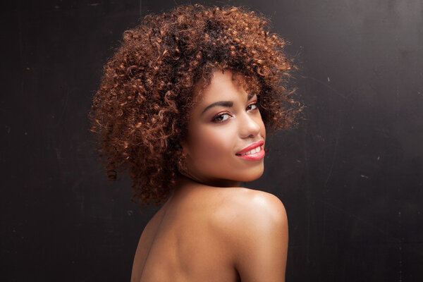 Portrait of young girl with afro.