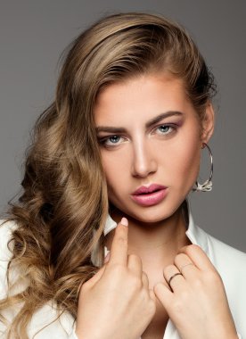 Portrait of elegant lady in white.