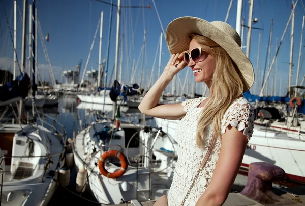 Attractive blonde woman in harbor. — Stock Photo, Image