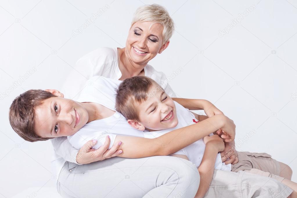 Family portrait, mother with sons.