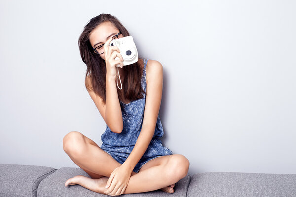 Teenage girl with camera.
