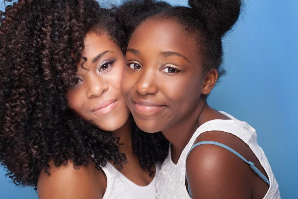 Closeup portrait of two young sisters. — Stock Photo, Image