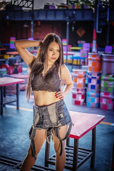 Asia Sexy lady in black shirt and short jeans — Stock Photo, Image